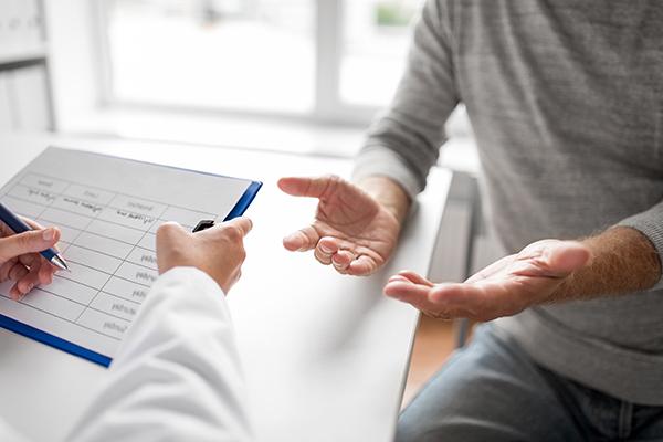 Two individuals discussing a report